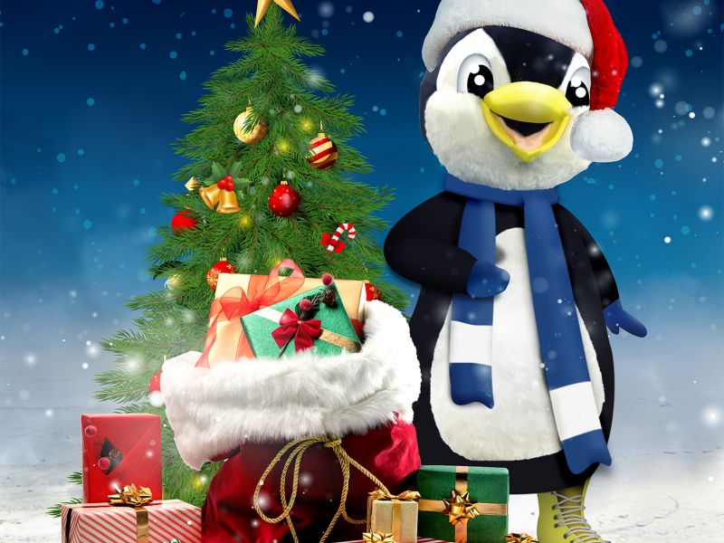 na zdjęciu plakat Boże Narodzenie z Areną Lodową.. na plakacie Pingwin w czapce Mikołaja i przystrojona choinka